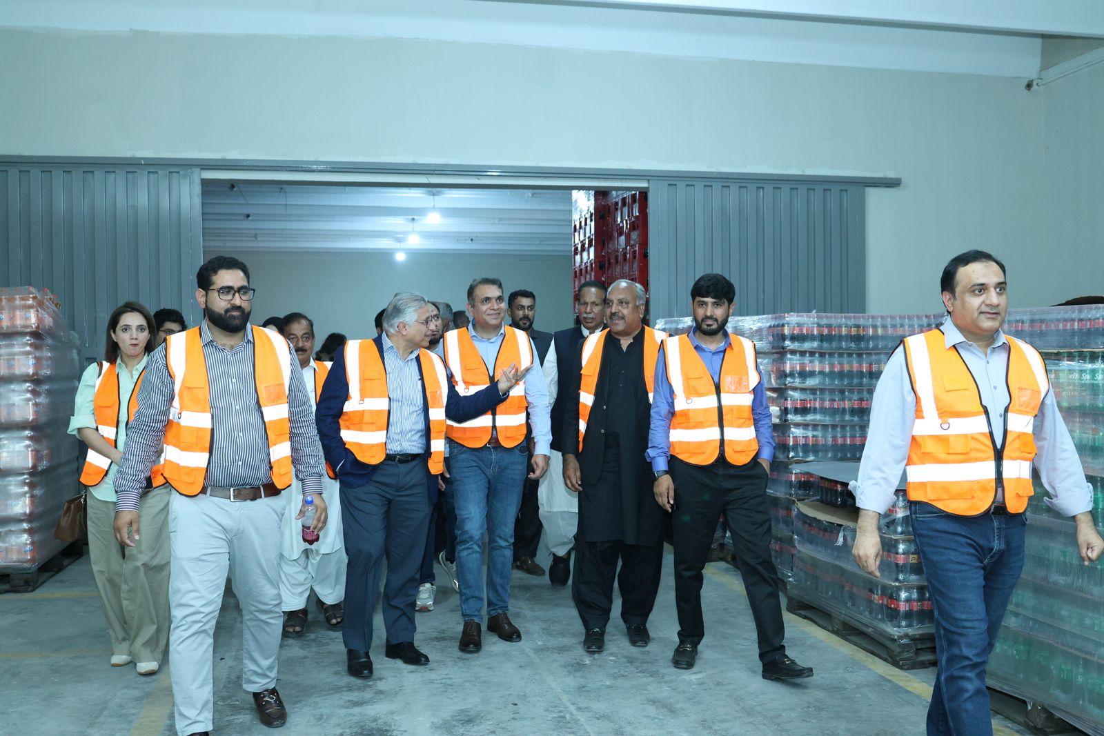 Barkat Corporation team touring the Coca-Cola distribution warehouse